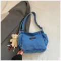 Casual denim shoulder bag for women, stylish dumpling crossbody bag with side pockets. - With Pendant / Light Blue
