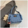 Casual denim shoulder bag for women trendy crossbody bag with cute bear pendant and multiple pockets. - Washed Light Blue (With Charm)