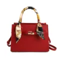 Elegant red PU leather women's handbag with stylish silk scarf handle and shoulder strap. - Burgundy