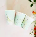 Mint green disposable paper cups with gold foil confetti dots, ideal for party decor and picnic use. - 270ml Hot Stamped Paper Cup / 8 Pieces/Pack / Mint Green