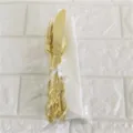 Gold disposable plastic cutlery set with knife fork spoon and napkin for party decorations. - 20cm Plastic Knife, Fork, Spoon and Napkin Set (1 Each) / Gold