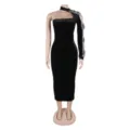 Detail view of the black velvet one-shoulder bodycon dress with sheer sleeve and rhinestones. - S / Dresses / Black