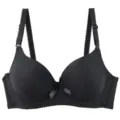 Detailed close-up of seamless black bra cups, adjustable straps, and cute center bow design. - 75B / Black