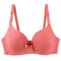 Seamless push-up bra detail showing smooth fabric, adjustable straps and delicate bow decoration. - 75B / Red