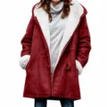 Detailed view of red fleece-lined hooded coat with cozy toggle buttons and deep side pockets. - Burgundy
