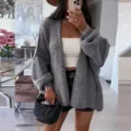 Detail shot of oversized gray knit cardigan featuring cozy V-neck and relaxed fit style. - S / Dark Gray
