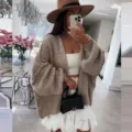 Detail view of women's casual loose knit cardigan sweater in solid khaki, cozy daily wear. - S / Khaki