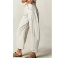 Detail view of women casual loose solid color barrel jeans beige curved seam design side shot - White