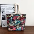 Canvas tote bag detail view, botanical leaf print pattern, thick rope handle, casual style. - Style 3