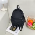 Casual black backpack lightweight travel school bag for students with front pocket and cord - Black