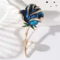 Exquisite blue rose enamel brooch detail, featuring gold-plated stem and elegant white pearl. - Blue