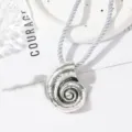Silver conch shell pendant necklace, beach style alloy jewelry detail shot for summer. - Conch Antique Silver Necklace