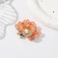 Exquisite enamel peony brooch with dazzling rhinestones and a central pearl, perfect accessory. - Champagne Pink