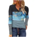 Detail of women long sleeve color block ribbed button top with delicate lace cuffs and print. - Bronzing-Sea Blue