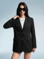 Detailed view of the stylish black suede texture blazer showcasing its refined lapel and buttons. - S / Tops / Black