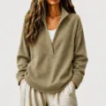 Close-up detail of women's waffle knit deep V-neck casual pullover sweater in khaki color. - Khaki
