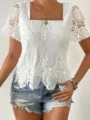 Detailed view of women white crochet lace short sleeve top with hollow out floral pattern. - S / Tops / White