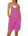 Close-up detail of the bright pink sleeveless romper with large side pockets and straps. - Purple
