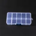 Clear plastic storage box with multiple compartments, ideal for jewelry, beads, and small parts. - White