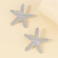 Sparkling rhinestone starfish stud earrings close up, luxury beach vacation fashion jewelry piece. - Starfish Silver Earrings