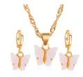 Chique goudkleurige vlinder sieradenset met ketting en oorbellen in wit acryl materiaal. - Set / Wit