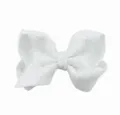 Gedetailleerd uitzicht van een glitterende witte pailletten strik haarspeld voor feestjes. - Wit