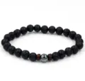 Natuurlijke zwarte vulkanische lavasteen kralenarmband met metalen middenkralen en hout. - Lavasteen En 1 Hematiet