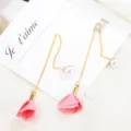 Delicate long tassel earrings featuring pearl studs and pink fabric rose flower pendants. - Pink