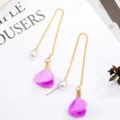 Long tassel earrings with pearl and purple flower pendant, elegant gold chain jewelry design. - Purple