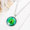 Green cat eye glass gem pendant necklace detail view fashion jewelry accessory item - Antique Silver + Green