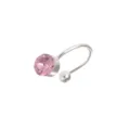 Detailed view of the silver-tone ear cuff featuring a sparkling pink crystal and smooth bead. - Pink