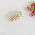Detail shot of 270ml disposable paper cups with elegant gold and white stripes design. - Bronzing Slanted Stripes