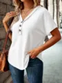 Detailed view of the casual white short sleeve V-neck top featuring a three-button placket. - White