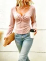 Detail view of the elegant pink long sleeve V-neck cross front top, stylish wear. - Pink