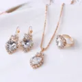 Gold heart crystal necklace earrings ring detail view, elegant wedding jewelry set closeup. - Heart / White