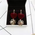 Gold-tone metal red velvet heart flower zircon drop earrings fine detailed closeup view. - Burgundy