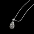 Detailed view of the sparkling rhinestone teardrop pendant necklace, elegant crystal jewelry. - White
