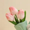 Artificial pink tulip flower arrangement in ceramic vase, elegant desktop decor variant. - Small Bouquet of Pink Tulips