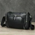 Zwarte lederen cilindrische heren schoudertas, vintage crossbody tas met grote capaciteit. - Zwart natuurlijk gekrompen leder