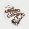 Detailed view of the vintage bronze multi-layer sweater chain with sun and moon pendants. - Sun and Moon Multi-layer Style / Bronze