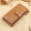 Bruine lederen lange portemonnee voor dames met drukknoop, stijlvolle vintage clutch. - Bruin