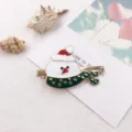 Leuke kerst sneeuwpop haarspeld met rode muts en groene sjaal voor vrouwen en kinderen. - Kleine Kerstsneeuwpop