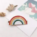 Close-up detail of a colorful enamel rainbow hair clip, featuring a cute duckbill clip design. - Seven-Color Rainbow
