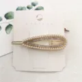 Elegante druppelvormige haarspeld met parels en strass, stijlvolle metalen haaraccessoire. - Driehoekige ronde parel en diamant
