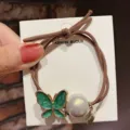 Korean style hair tie featuring a green enamel butterfly and pearl pendant for women. - Butterfly/Green