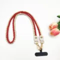 Détails de la lanière de téléphone tressée rouge et blanche avec bouclerie dorée et cuir. - 80cm / Rouge