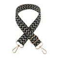 Detailed view of black and white woven wide bag strap with adjustable gold hardware. - Gold Buckle / Beige With Black Edge