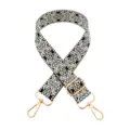 Detailed close-up showcasing the black and white woven pattern and polished gold hardware. - White & Beige on Black