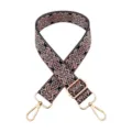 Detailed view of the wide embroidered replacement bag strap with adjustable gold hardware. - Black Base Deep Pink