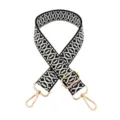Detail view of black white geometric woven replacement bag strap with gold metal hardware. - Black and White